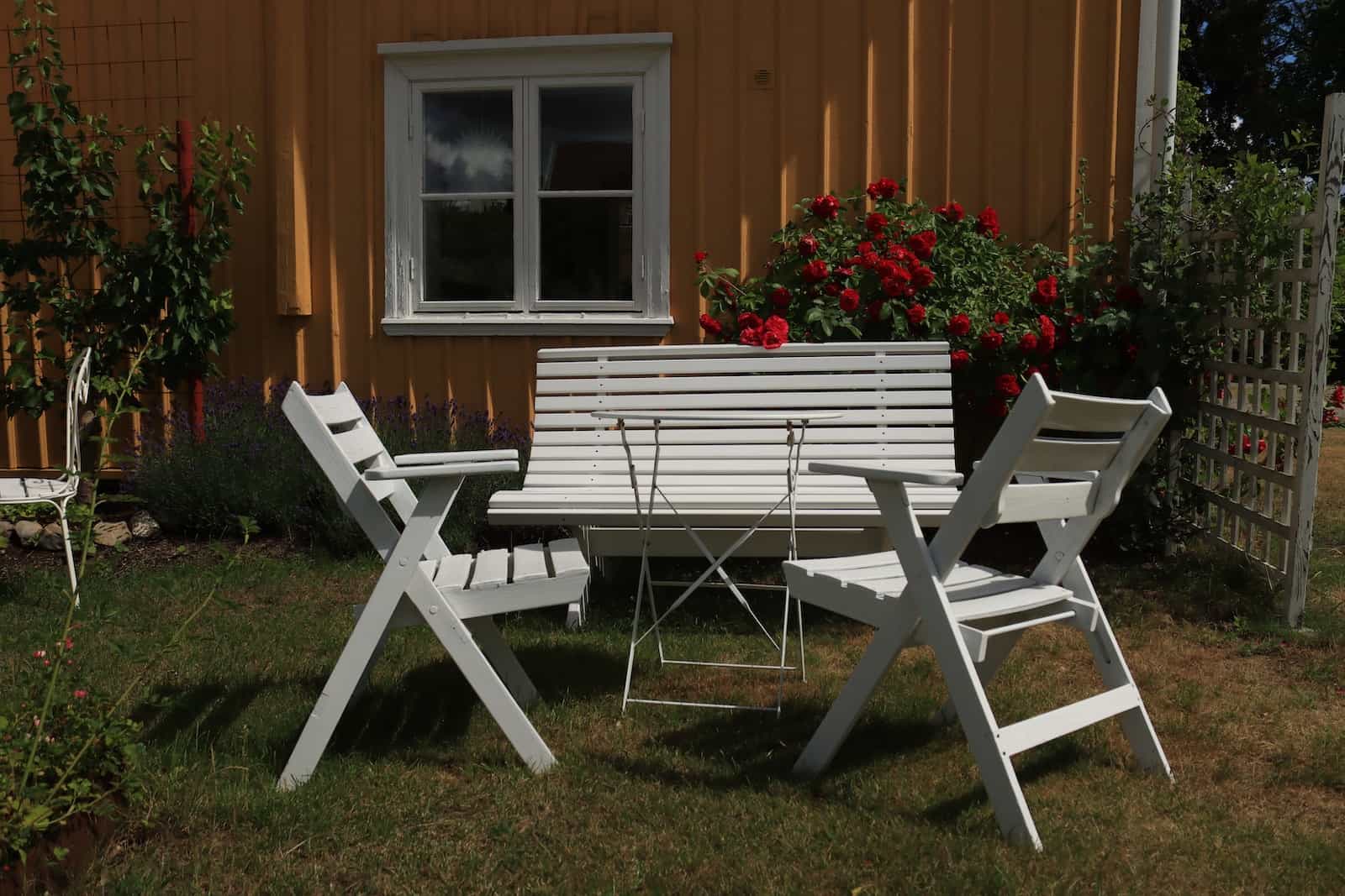 White Wooden Picnic Table on Green Grass Field